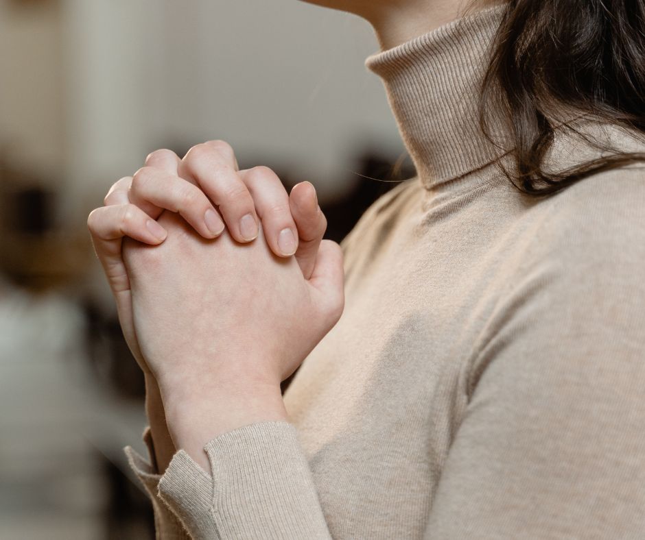 Hands clasped in prayer, symbolizing trust and connection with God.