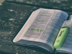 Grace and Truth - reading the Bible with highlighter for spiritual nourishment.