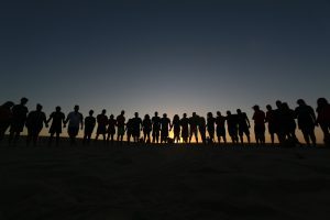 Group of believers praying together for healing and restoration.