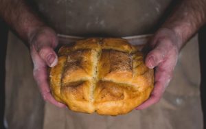 A loaf of bread held in hands - signifying God's daily bread.