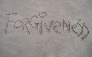 Forgiveness written in the sand.