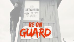 A sign that says lifeguard on duty. Symbolises to be on guard.